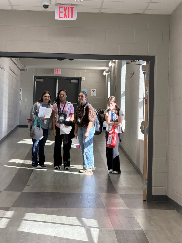 four students in hallway 