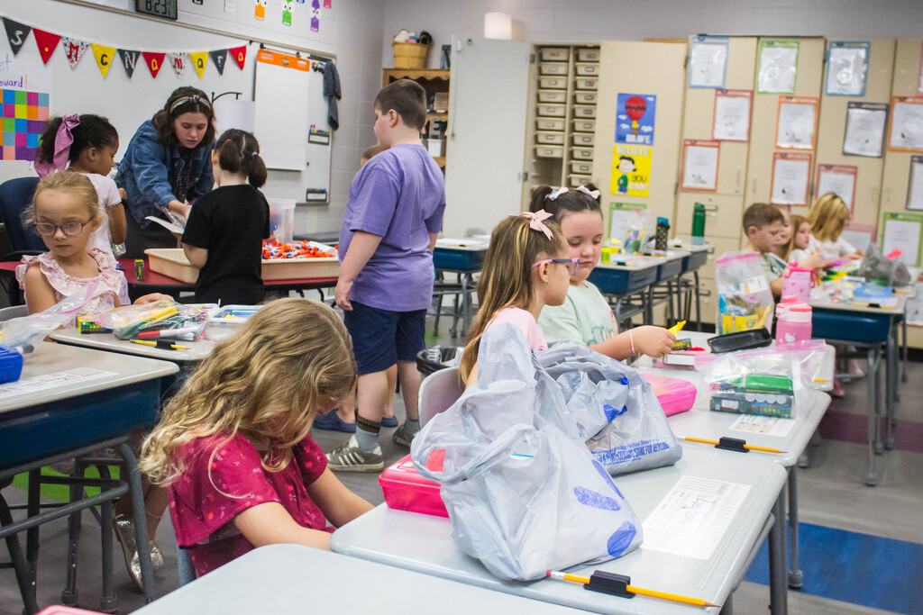 Mrs. McNamara's class organizes their supplies.