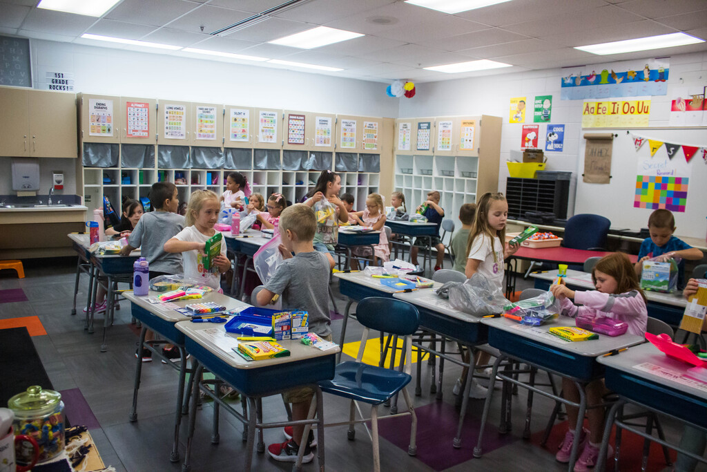 Mrs. McNamara's class organizes their supplies.