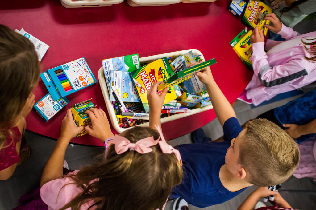 Mrs. McNamara's class organizes their supplies.