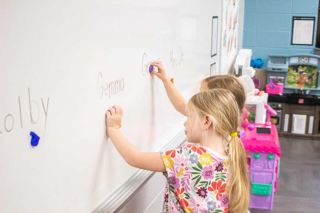 DES Preschool students practice spelling their name