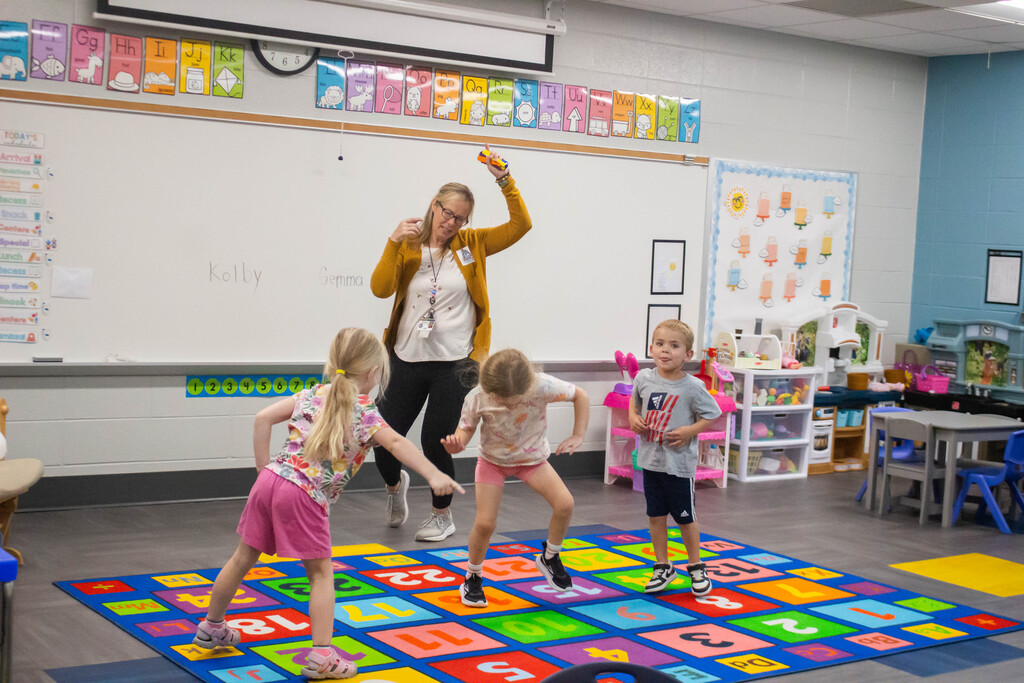 DES Preschool students practice spelling their name