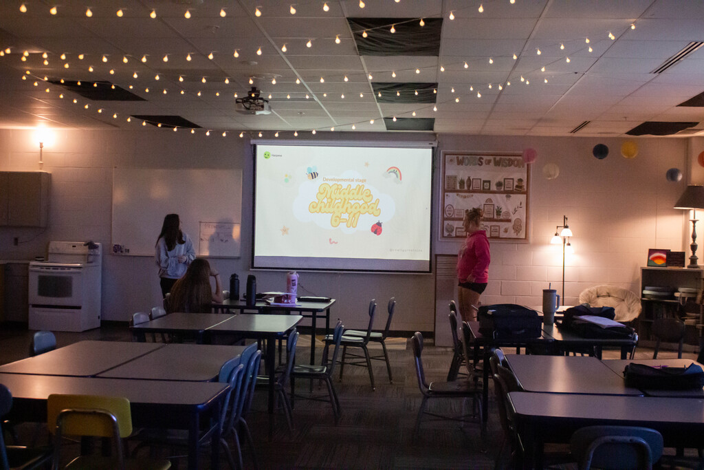 SDMS students present their research on child development stages.