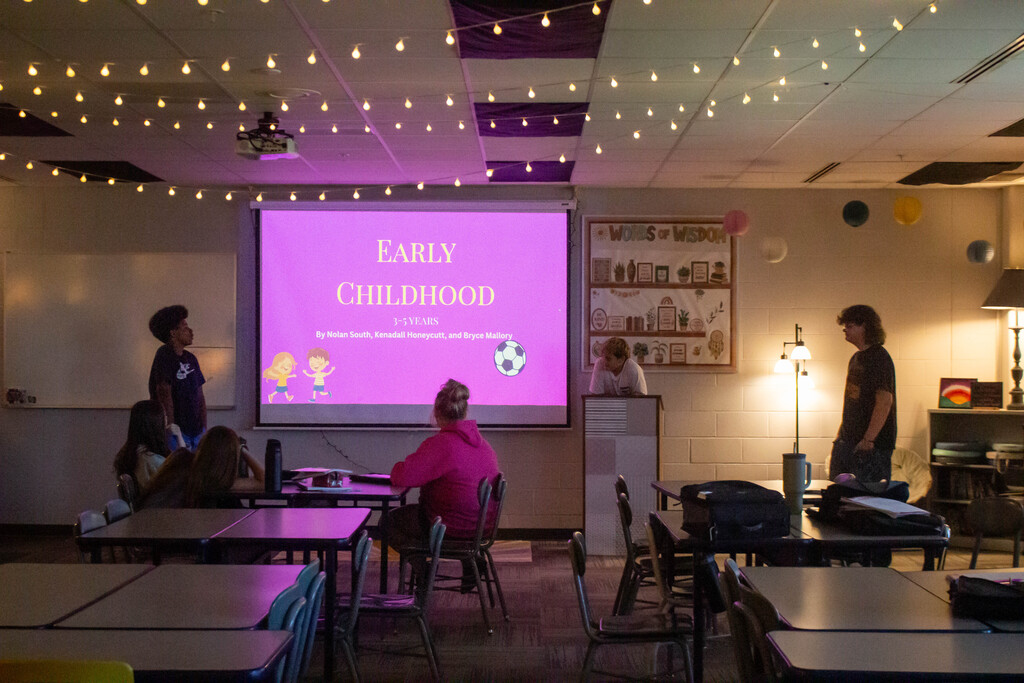 SDMS students present their research on child development stages.