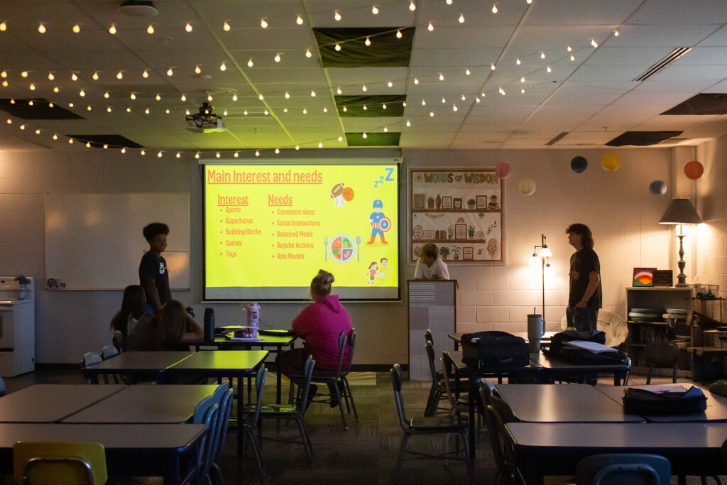 SDMS students present their research on child development stages.