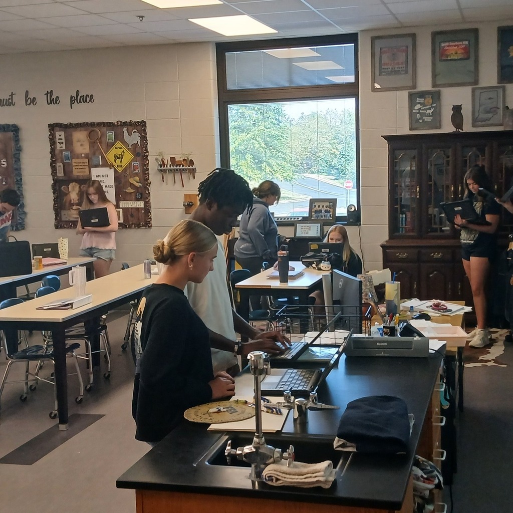 South Dearborn High School Animal Science students working on laptops at lab tables during a classroom research activity.