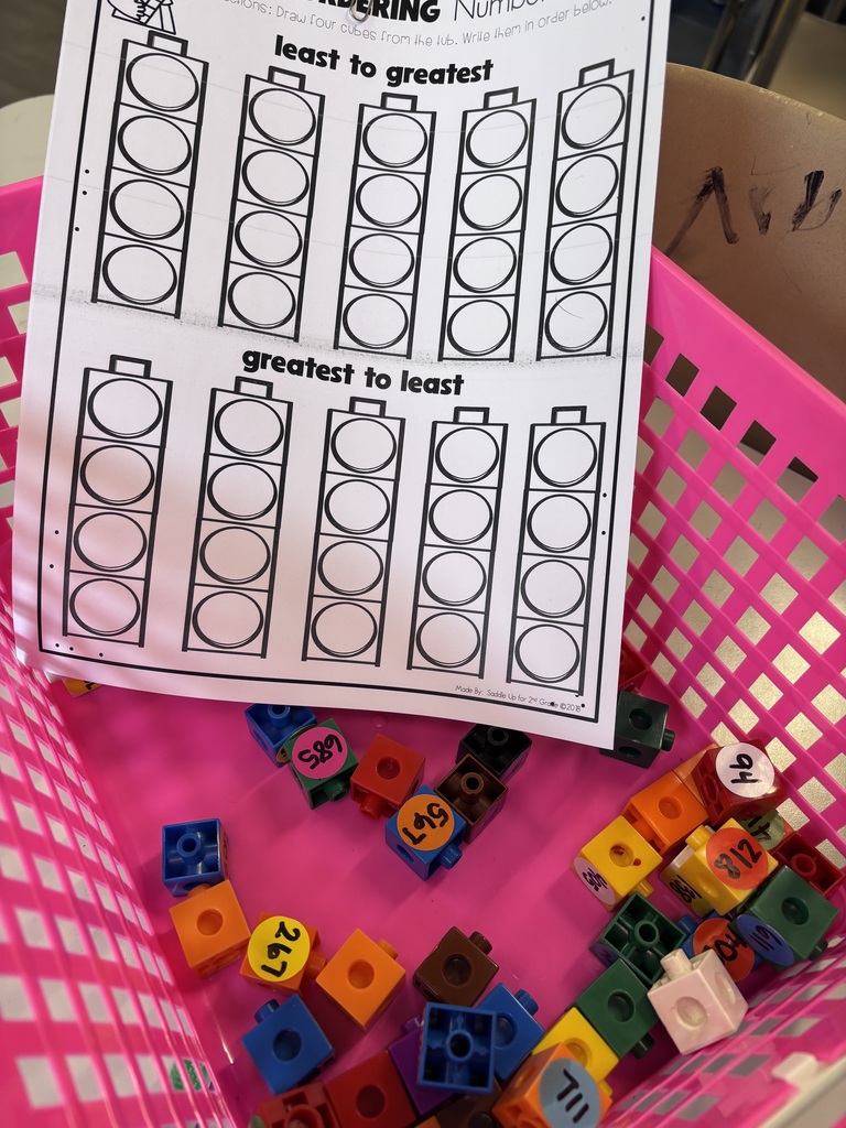 Least to greatest and greatest to least number cube ordering worksheet with colorful place value cubes in a Dillsboro Elementary classroom.