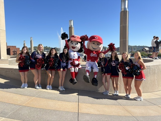 South Dearborn cheerleaders pose with Cincinnati Reds mascots Rosie Red and Mr. Red at the Jeff Wyler Fast Lane Event.