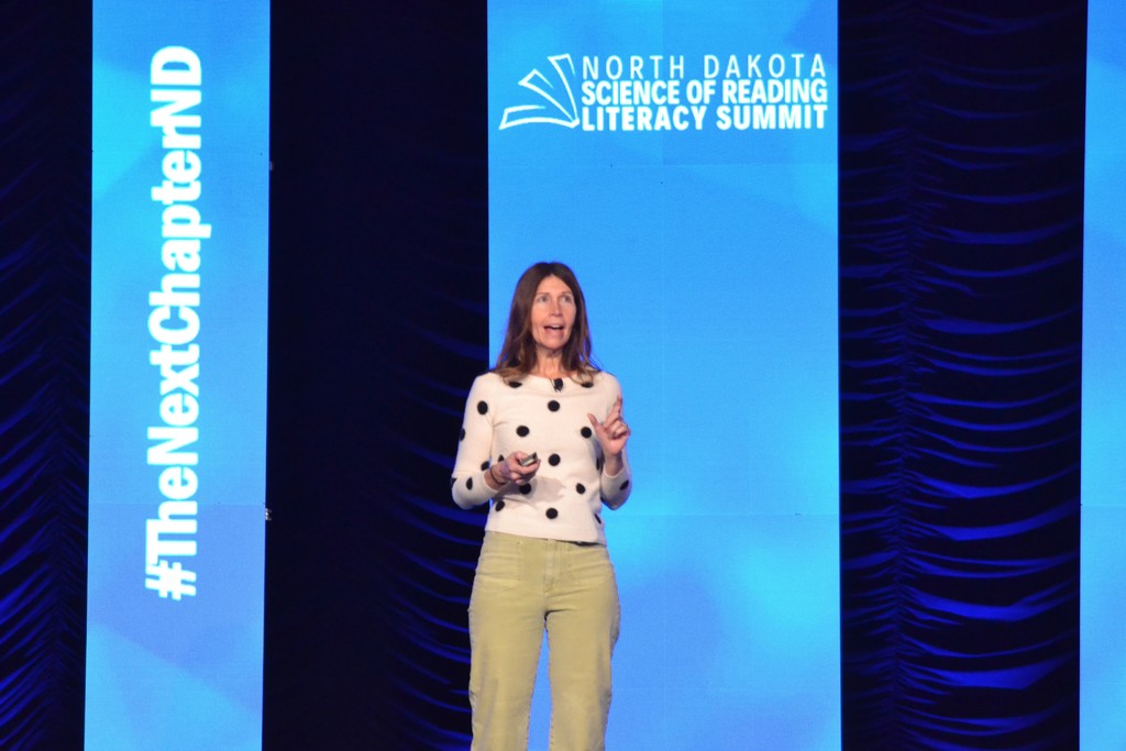 Jamey Peavler speaking on stage