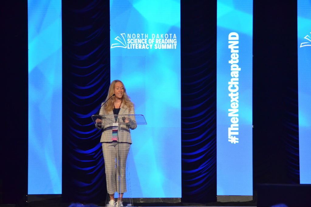 picture of woman standing at a podium