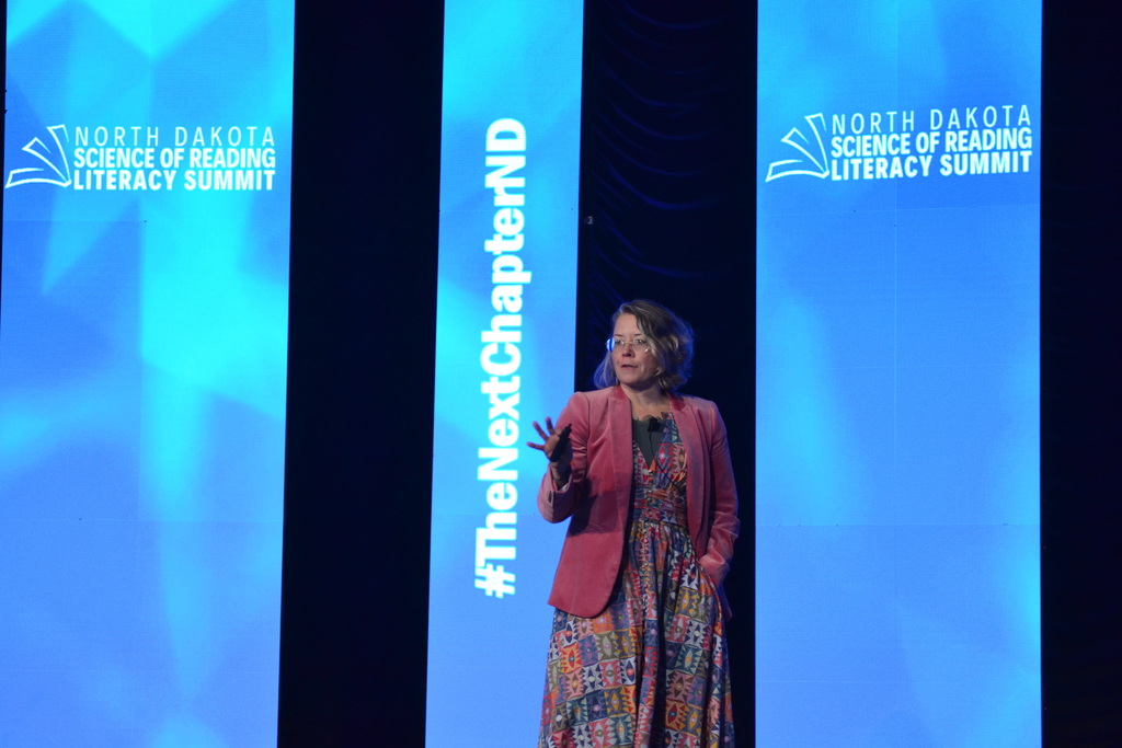 genevieve thomas speaking on stage