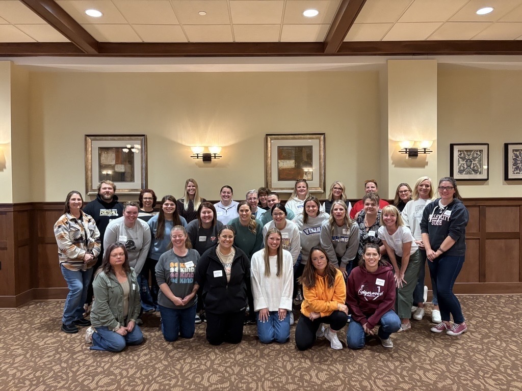 Group picture of teachers smiling at the camera
