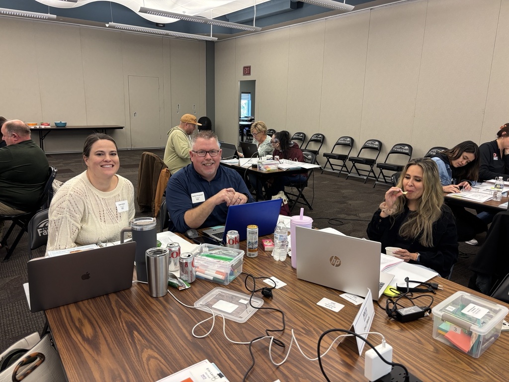 three educators smiling for the camera