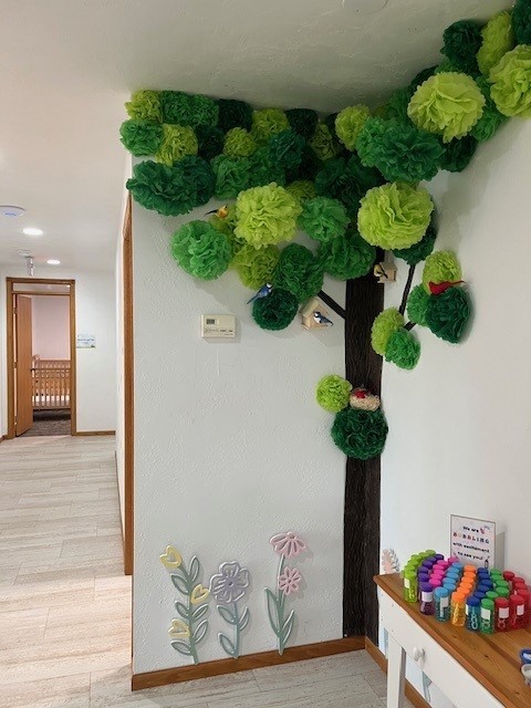 tissue paper tree in the corner of a room