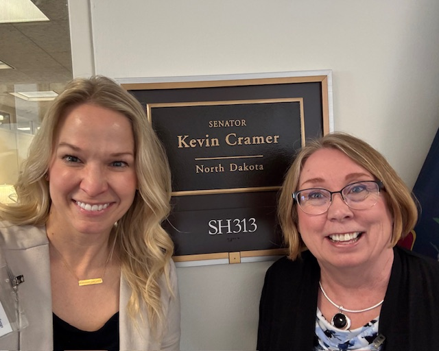 Lori and Dawn in front of Senator Kevin Cramer's office