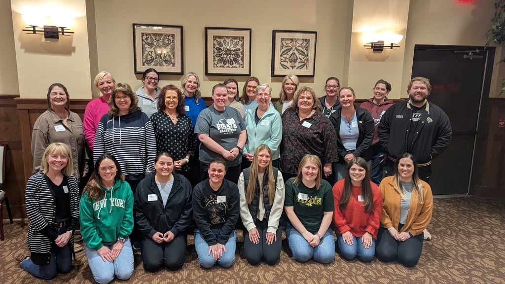 24 north dakota teachers smiling at the camera