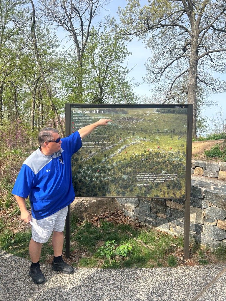 Mr. Bryant, SEMS Principal,  pointing out information about Little Round Top.