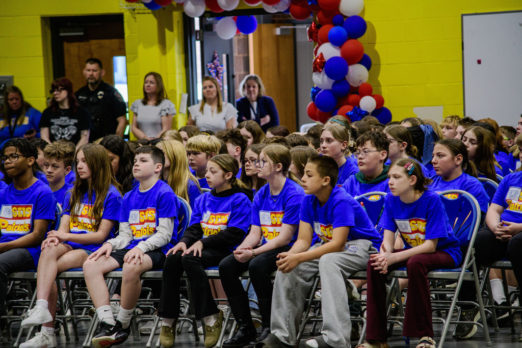Students in SEIS Patriot Program T-Shirts listening to a speaker at the Patriot Program Assembly.