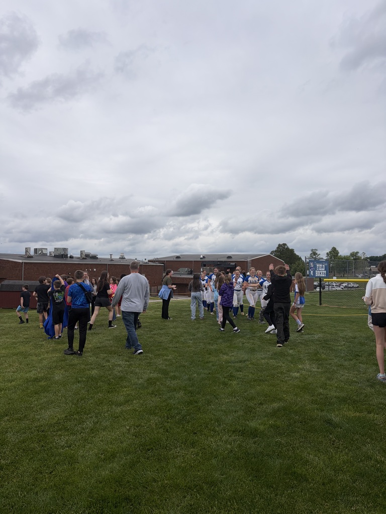 A group of students and staff showing their support to the KDHS Girls' Softball Team