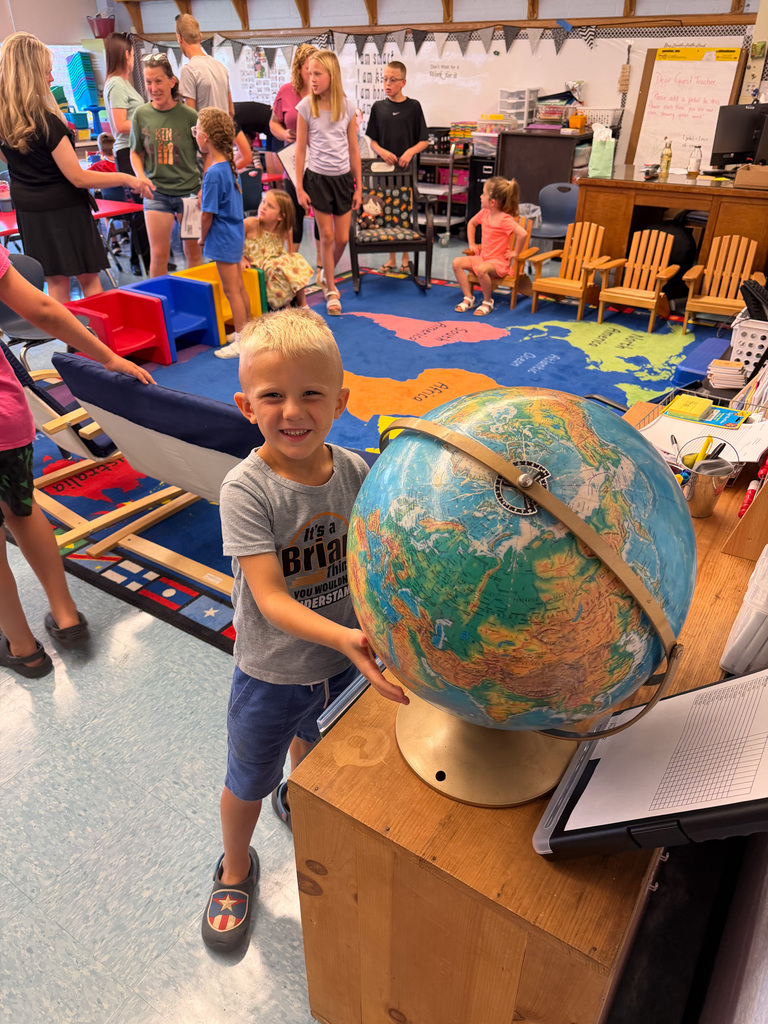 Photo of a child with a globe