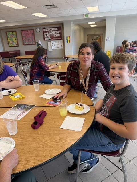 parent and student seated at table