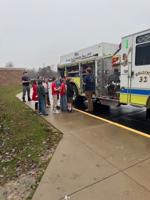students outside a fire truck