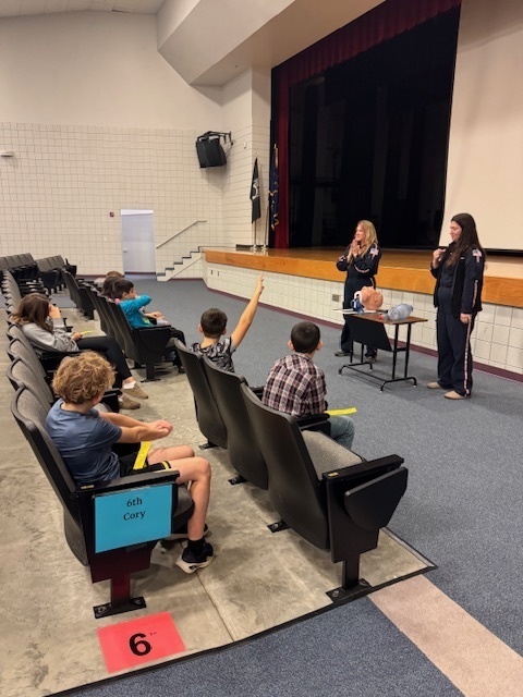 students sitting in an auditorium