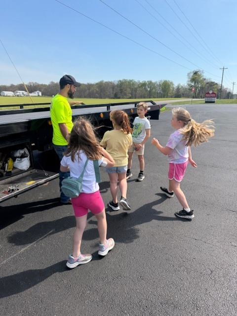 students outside a truck