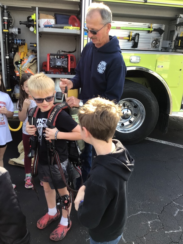 students outside a firetruck
