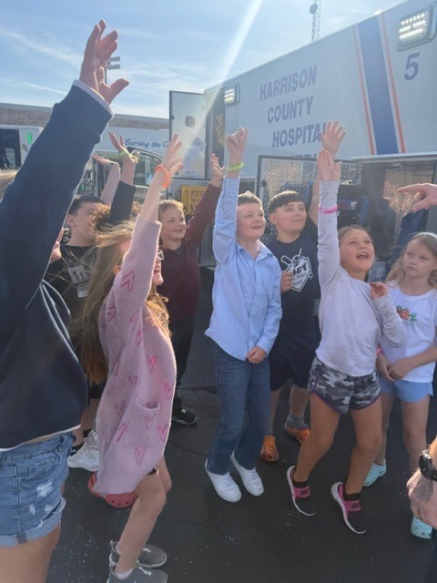 students outside a truck
