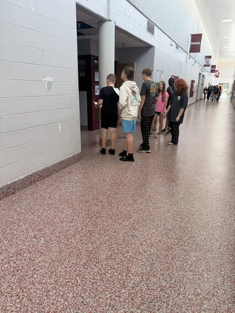 students in the hallway of the jr high