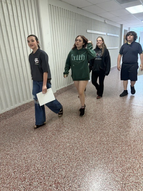 students walking in the jr high hallway
