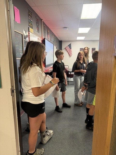 6th graders standing in a jr high classroom