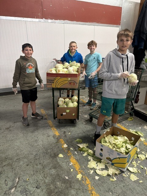 students working in a food pantry