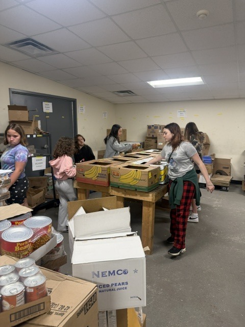 students working in a food pantry