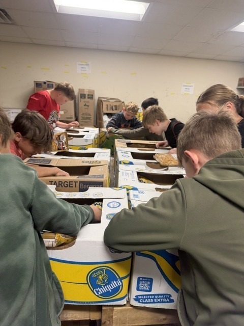 students working in a food pantry