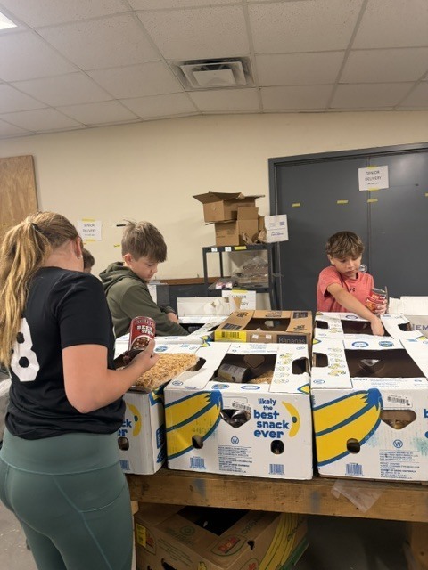 students working in a food pantry