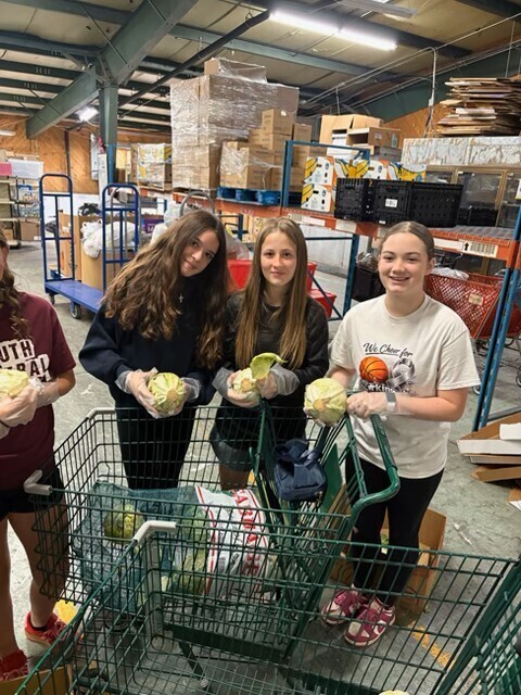 students working at a food pantry