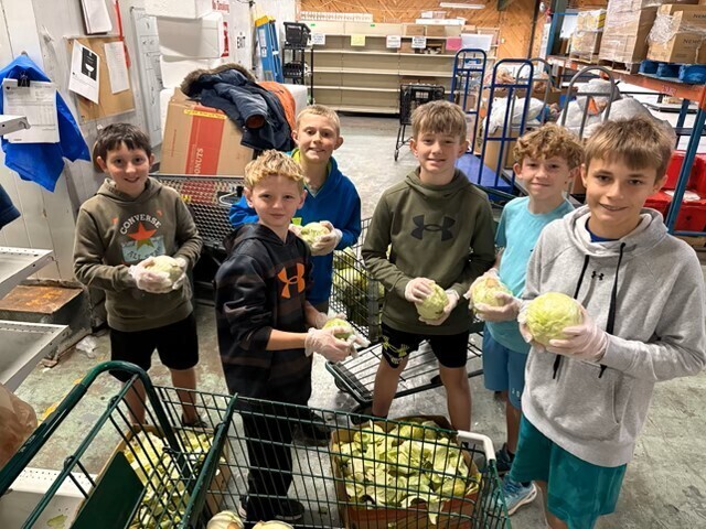 students working at a food pantry