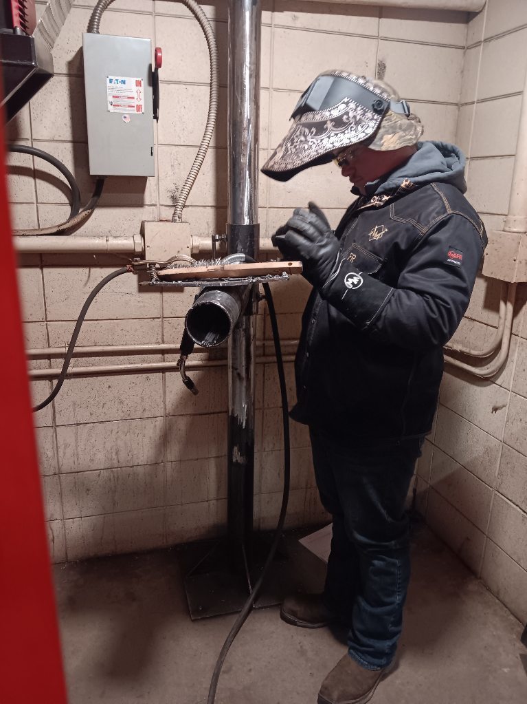 Kayne Ellis (Albany) inspects his joint fit-up and alignment prior to welding with GMAW