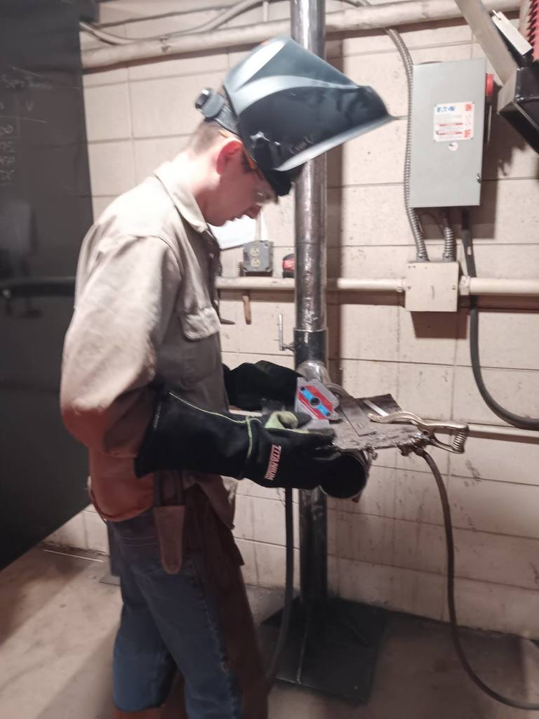 Evan Weller (South Harrison) fits up his tee joint with GMAW