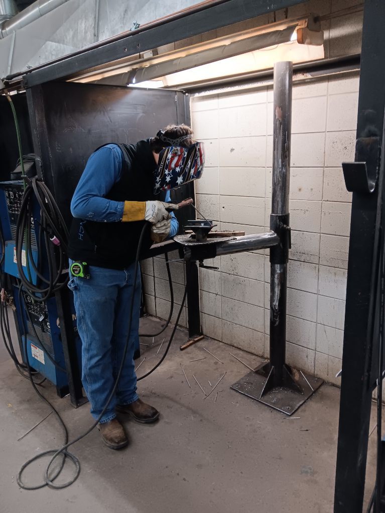 Lyle Pollard (Princeton) welds out his SMAW coupon