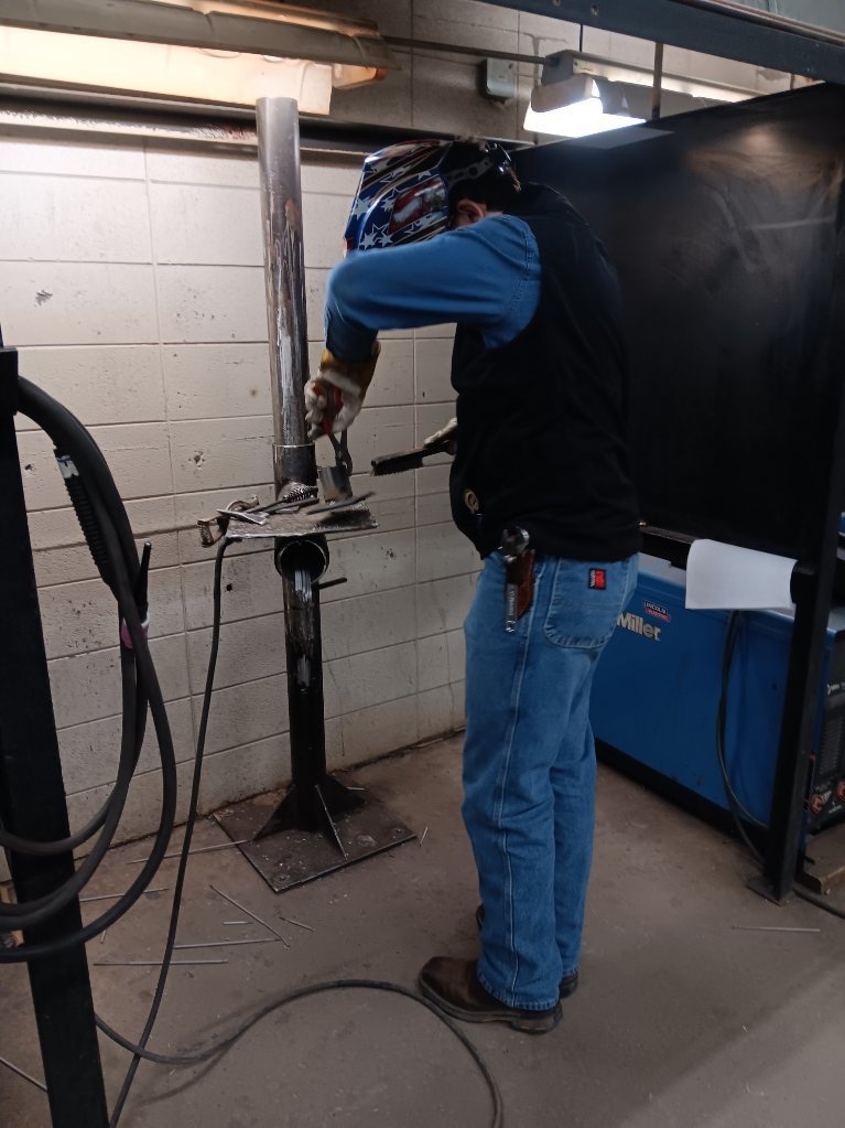 Lyle Pollard (Princeton) welds out his SMAW coupon