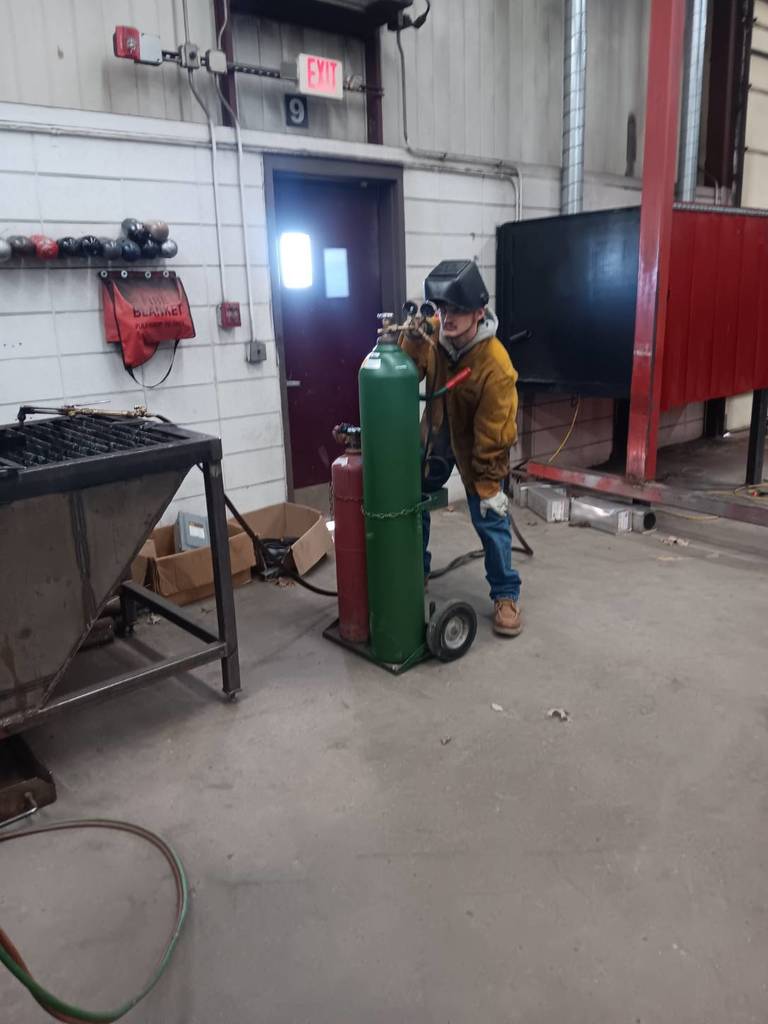 Maverick Barth (Gilman City) adjusting his operating pressures on his Oxy-fuel cylinders