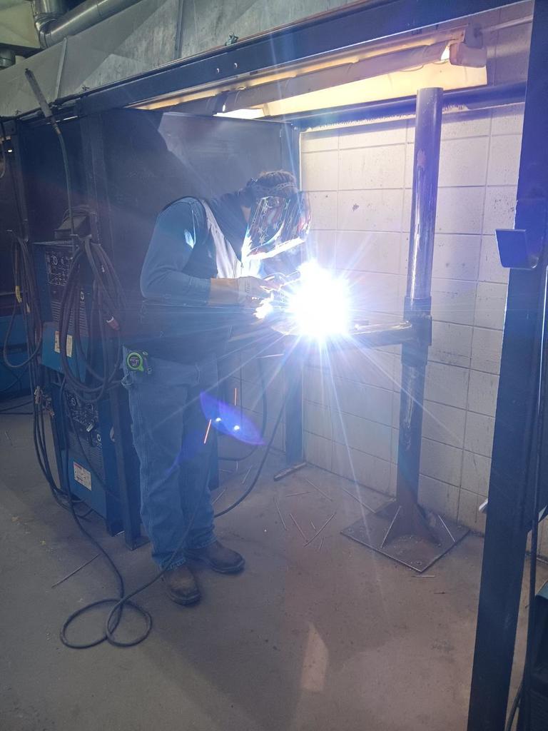 Lyle Pollard (Princeton) welds out his SMAW coupon