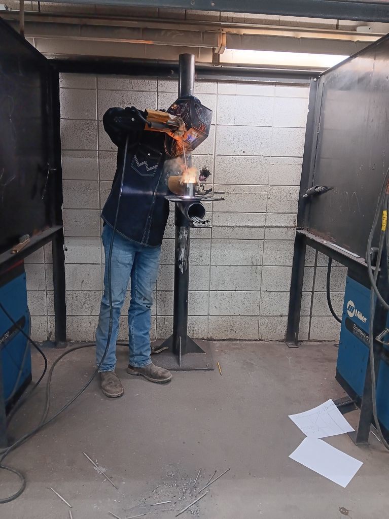 Logan Cornelison (South Harrison) works to complete his SMAW project in time 