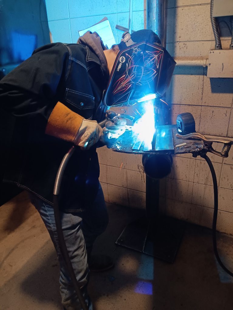 Logan Cornelison (South Harrison) makes his 10" long fillet weld in a tee joint with GMAW