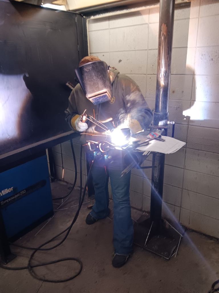 Samantha Berry (South Harrison) makes her pipe to plate weld with E7018