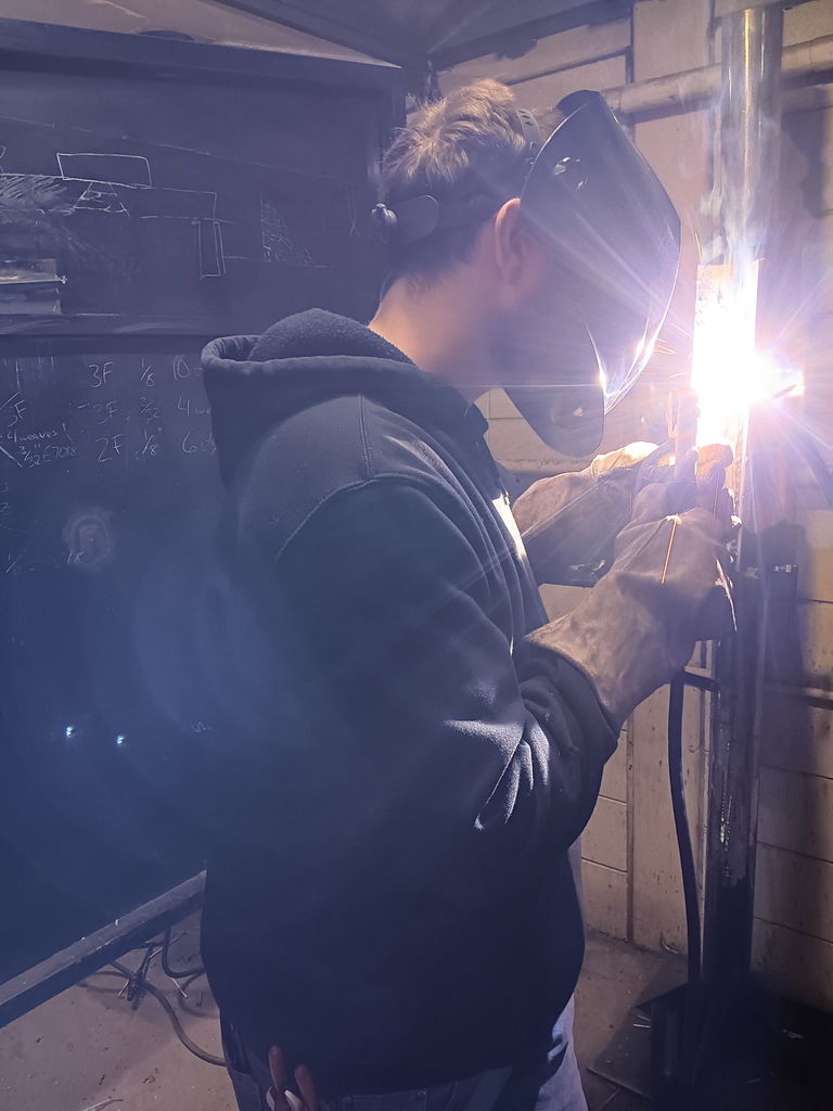 Kole Rhea practicing welding
