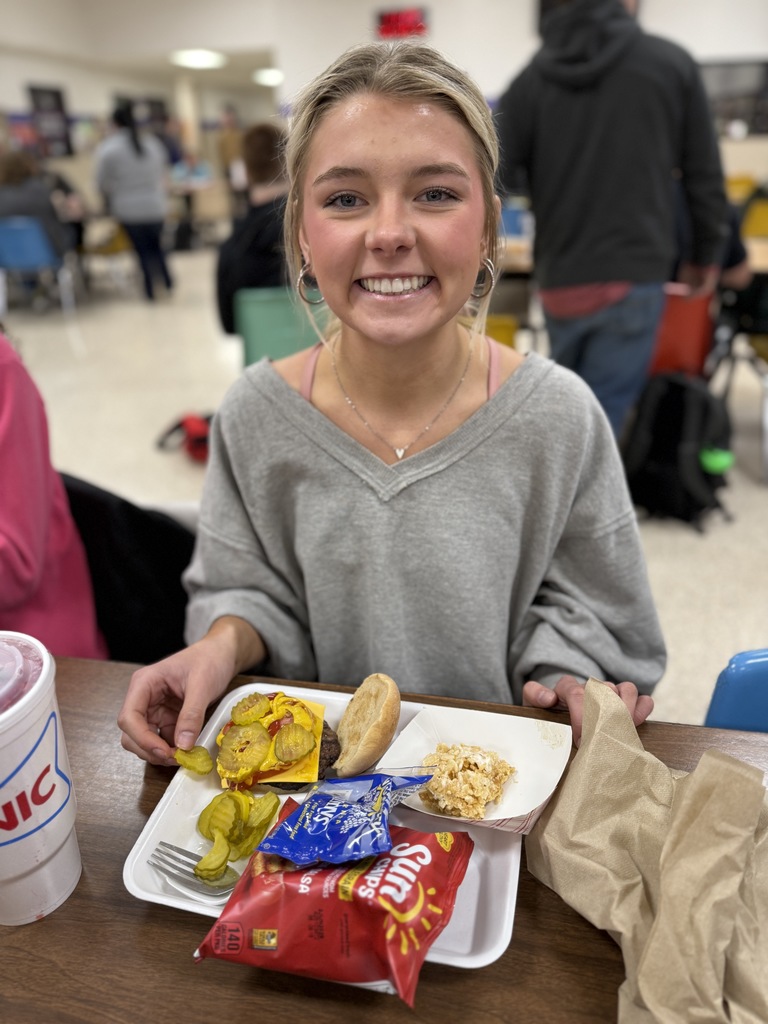 Lucy has her burger prepped for lunch 